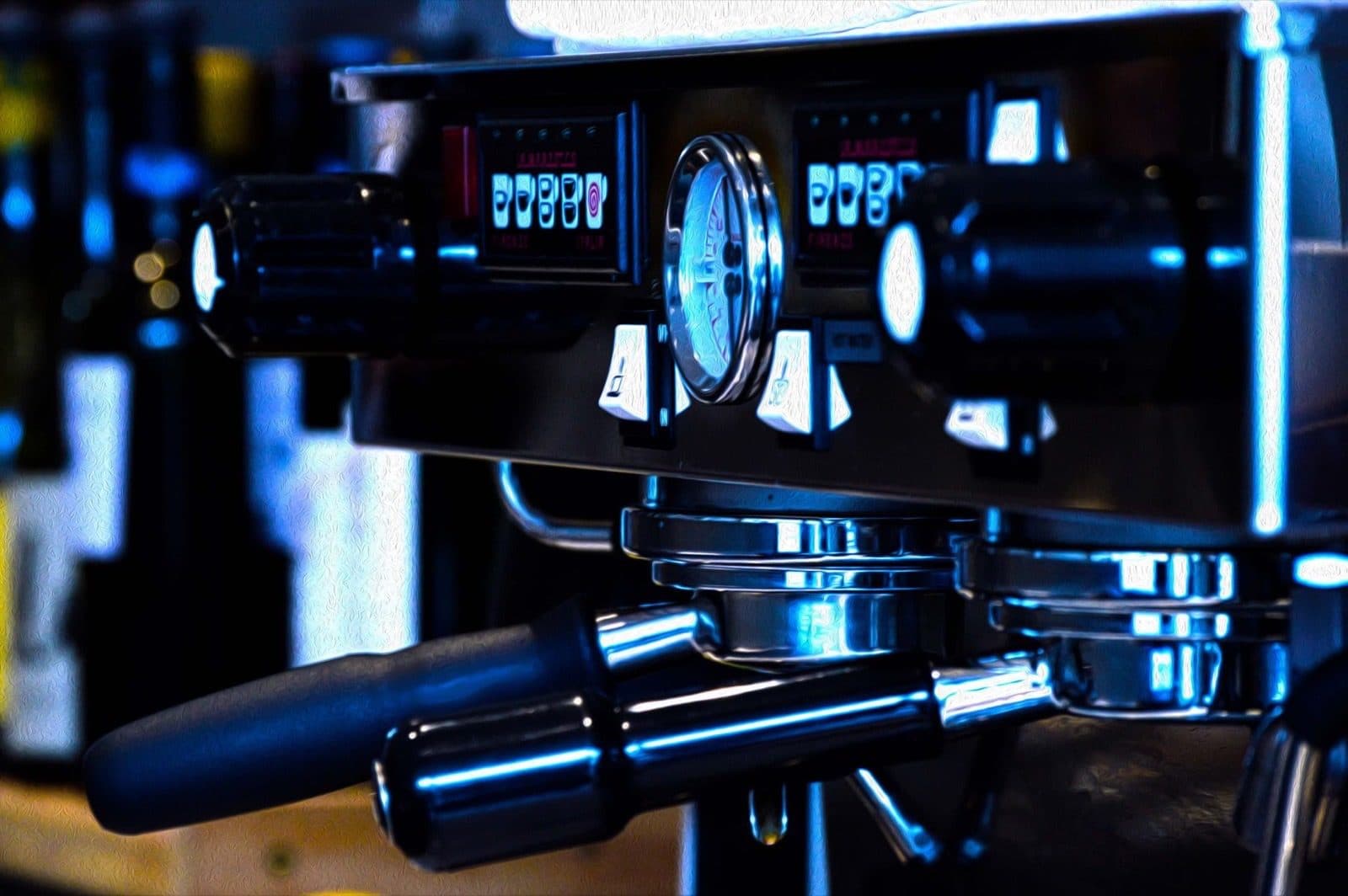 Close-up of an espresso machine with pressure gauges.