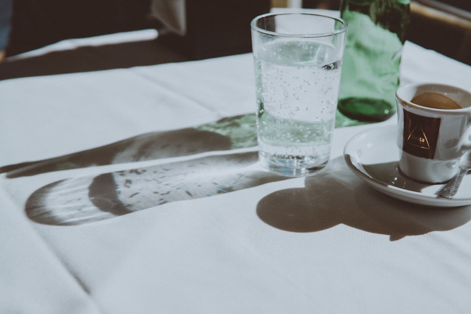 Clear glass of water on a cafe table.